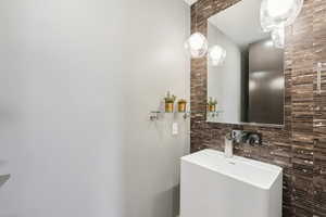 Bathroom with backsplash and sink