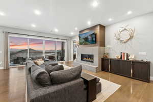 Living room with light hardwood / wood-style flooring