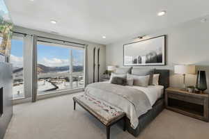 Carpeted bedroom featuring a mountain view