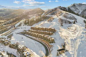 Snowy aerial view featuring a mountain view