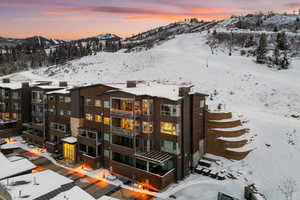 Snowy aerial view with a mountain view