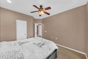 Bedroom featuring carpet flooring and ceiling fan