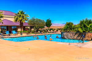 View of swimming pool with a mountain view and pool water feature