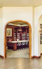 Wine cellar with hardwood / wood-style flooring