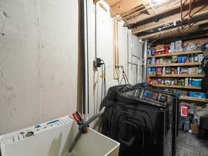 Laundry room with washing machine and dryer