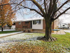 View of front of house with a front yard