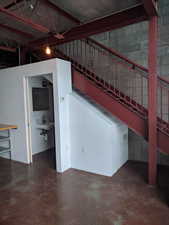 Interior space with sink and concrete floors