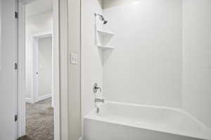 Bathroom featuring tiled shower / bath