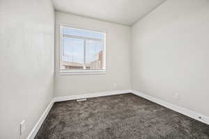 View of carpeted spare room