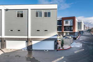 View of property with a garage