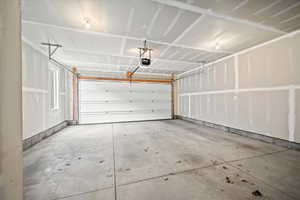 Garage featuring a garage door opener