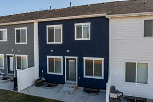 Back of house featuring central AC unit and a patio area