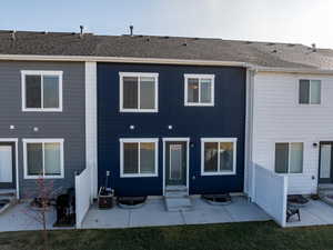 Back of property with a patio