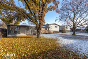 fenced in backyard with mature trees