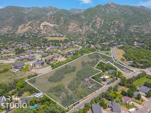 Birds eye view of property featuring a mountain view