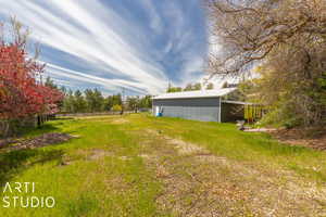 View of yard featuring an outdoor structure