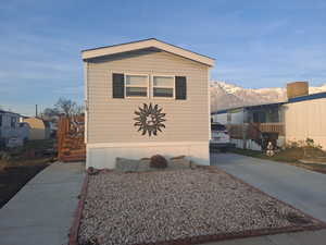 View of property exterior with a mountain view