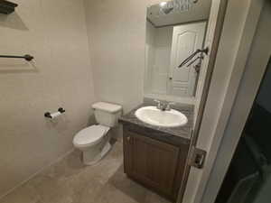 Bathroom featuring vanity and toilet