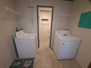 Laundry area with washer and clothes dryer