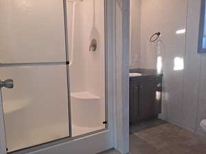 Bathroom with tile patterned flooring, vanity, and toilet