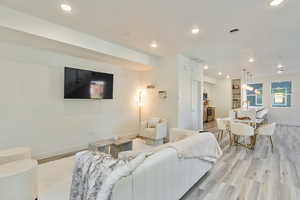 Living room with light hardwood / wood-style floors