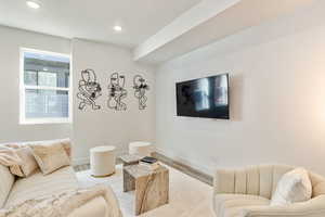 Living room with light wood-type flooring