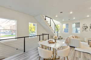 Dining space with light wood-type flooring