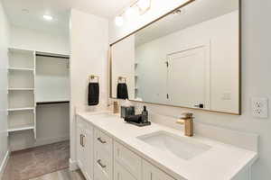 Bathroom featuring hardwood / wood-style floors and vanity