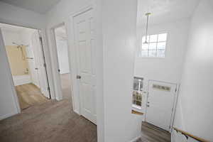 Foyer featuring hardwood / wood-style floors and an inviting chandelier