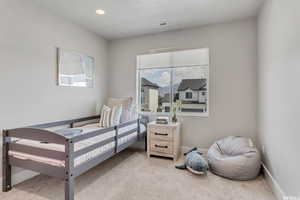 View of carpeted bedroom