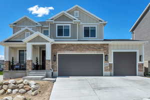 Craftsman inspired home featuring a garage