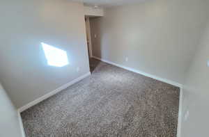 Empty room featuring carpet