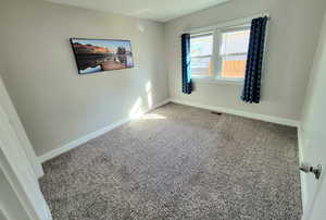 View of carpeted spare room