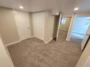 Unfurnished bedroom featuring carpet flooring and a closet