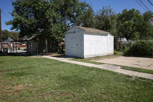 Garage featuring a yard