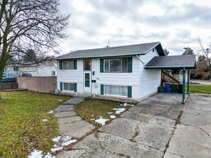 Split foyer home with a front yard