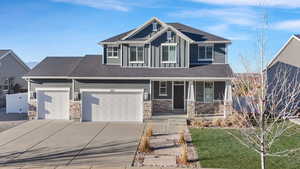 Craftsman-style home featuring a front lawn and covered porch