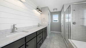 Bathroom with vanity and an enclosed shower