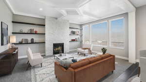 Living room featuring tile patterned flooring, built in shelves, and a stone fireplace