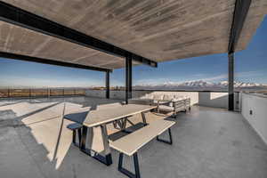 View of patio with a mountain view and an outdoor hangout area