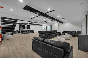 Living room featuring beam ceiling and light hardwood / wood-style floors