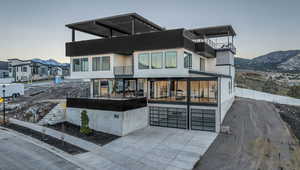 Back of property featuring a mountain view