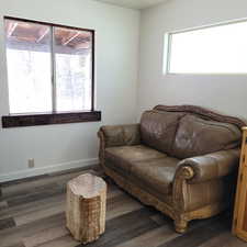 Living area featuring dark hardwood / wood-style flooring