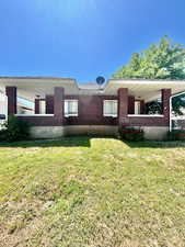 View of property exterior featuring a yard