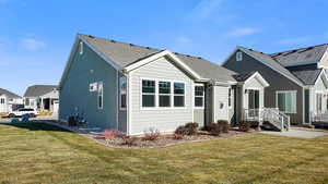 Rear view of property featuring a patio