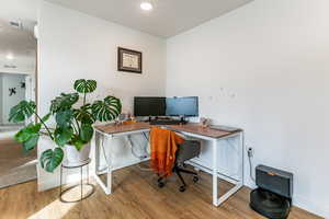 Office with wood-type flooring