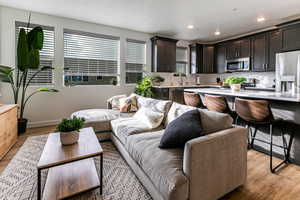 Living room with light hardwood / wood-style flooring