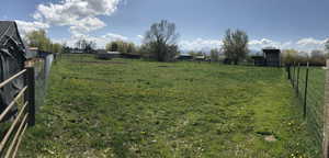 View of yard with a rural view