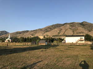 Property view of mountains featuring a rural view