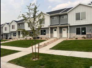 View of front of property with a front lawn